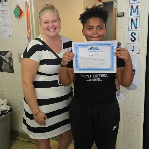 Jeremih Davis, Connell's Stairclimber for October, poses with his award plaque.